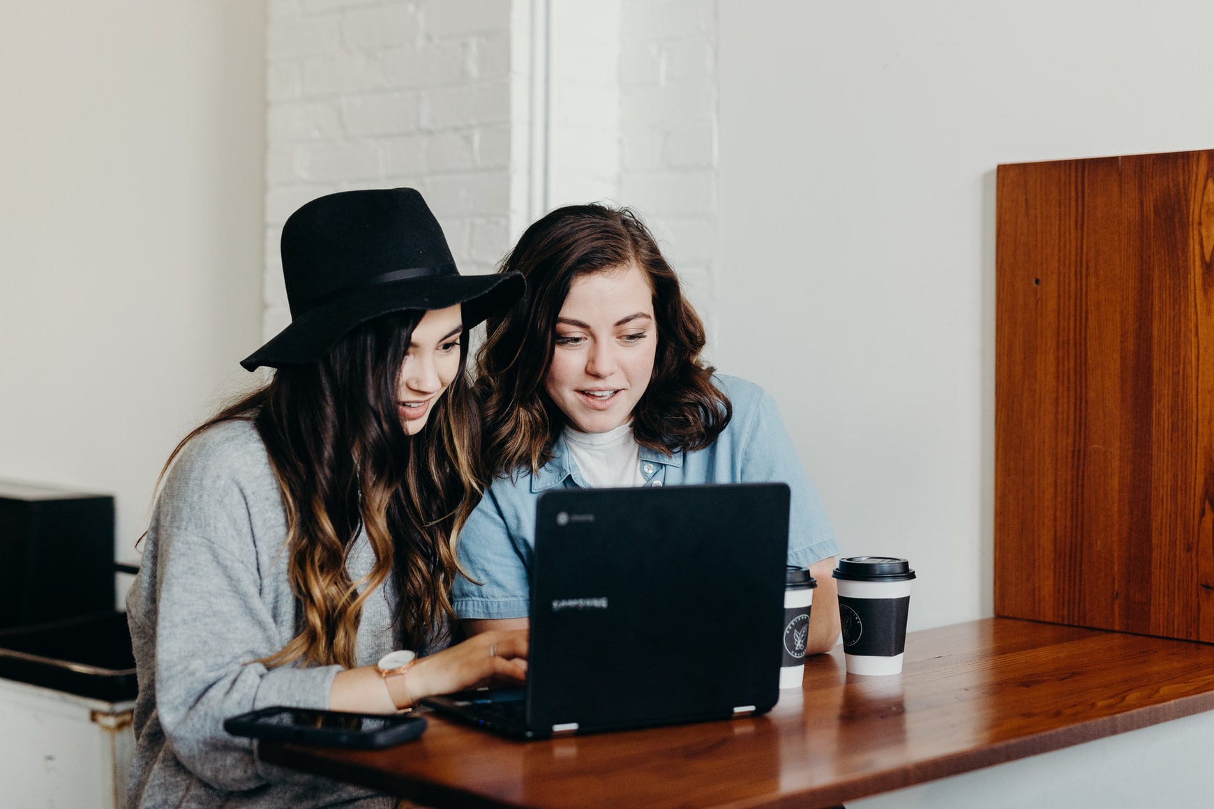 People using a laptop together